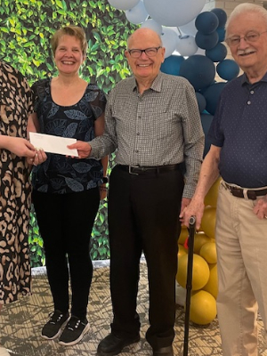 Just one week after our 'Adopt a Dahlia' fundaiser started, Trinity Lodge's amazing residents, family members and staff have donated more than $2,000,00.. Residents Ron Freckleton and Ed Hemming with Team Trinity Lodge captain, and our Life Enrichment Assistant, Trenda Upton, present the donations to Lisa Laughton, Philanthropy Officer of Alzheimer Society of Calgary.